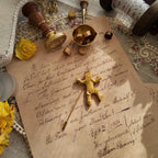 The "Golden Reminder to Smile," a rare vintage modernist brooch by Van Wyk, featuring a minimalist, abstract figural design in a soft matte gold finish.