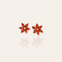 The "Holiday Belle," a pair of festive, vintage 1970s Avon stud earrings, designed as a classic Christmas Poinsettia flower in vibrant red enamel.