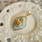 Close-up detail of the intricately detailed vintage brass duck, clearly showing its tiny scarf.