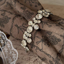 The delicate Weiss rhinestone bracelet worn on a wrist, showcasing its beautiful drape and how it catches the light to create an effortless, everyday sparkle.