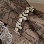 The delicate Weiss rhinestone bracelet worn on a wrist, showcasing its beautiful drape and how it catches the light to create an effortless, everyday sparkle.