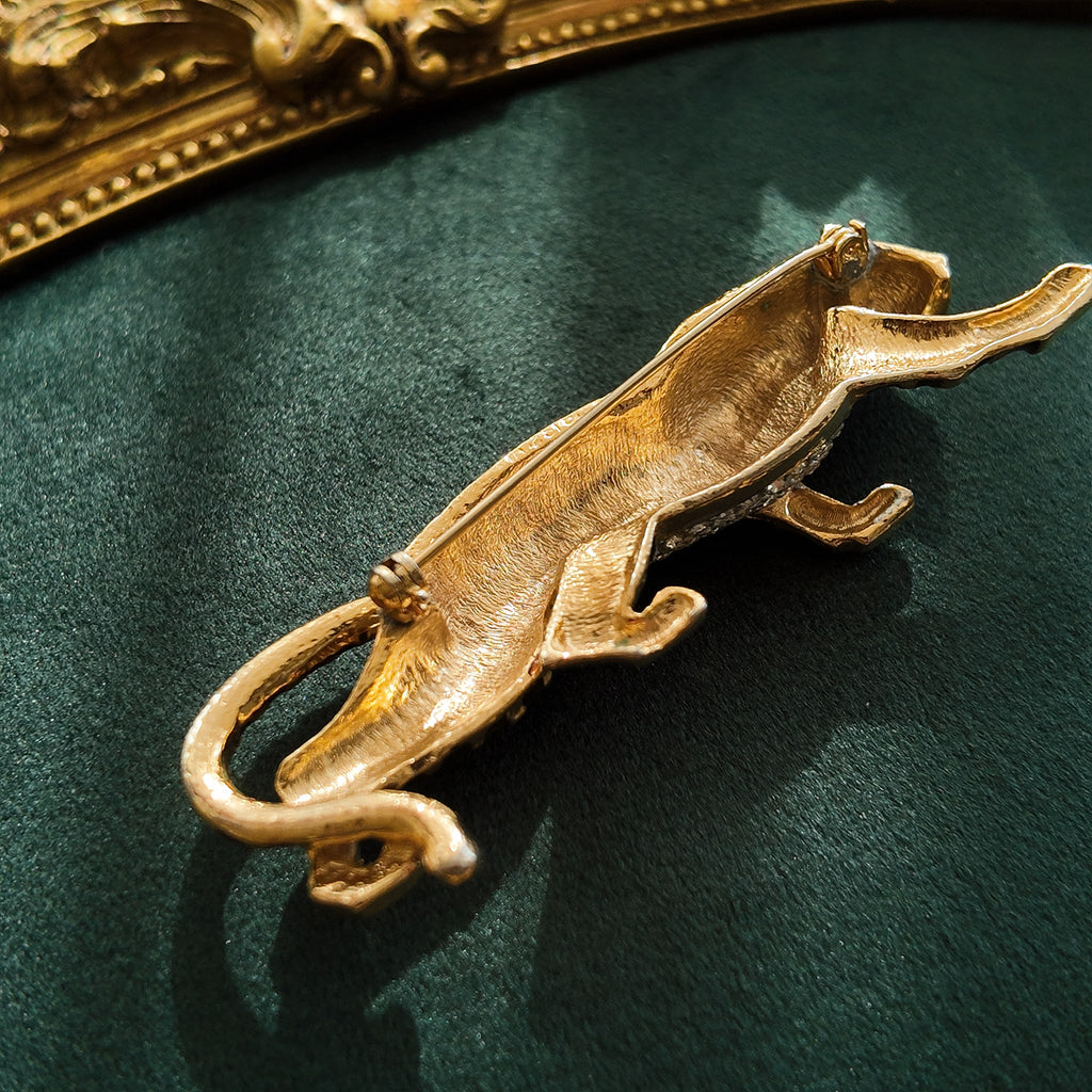 The reverse side of the large vintage animal brooch, showing its solid gold-plated construction and the secure pin mechanism.