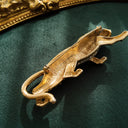 The reverse side of the large vintage animal brooch, showing its solid gold-plated construction and the secure pin mechanism.