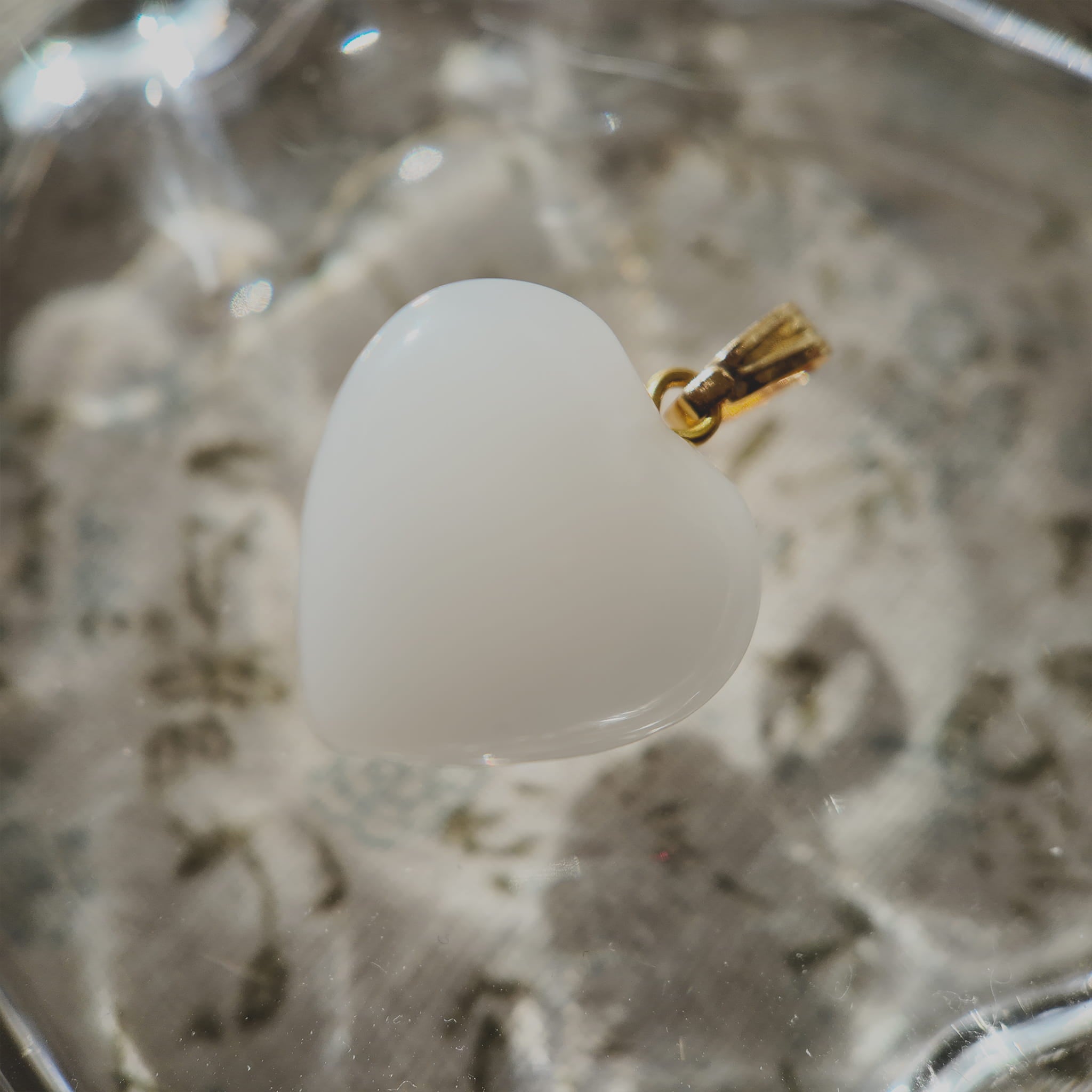 Texture detail of vintage Milk Glass, showing its opaque, creamy white hue and smooth touch, resembling white coral or a polished shell.