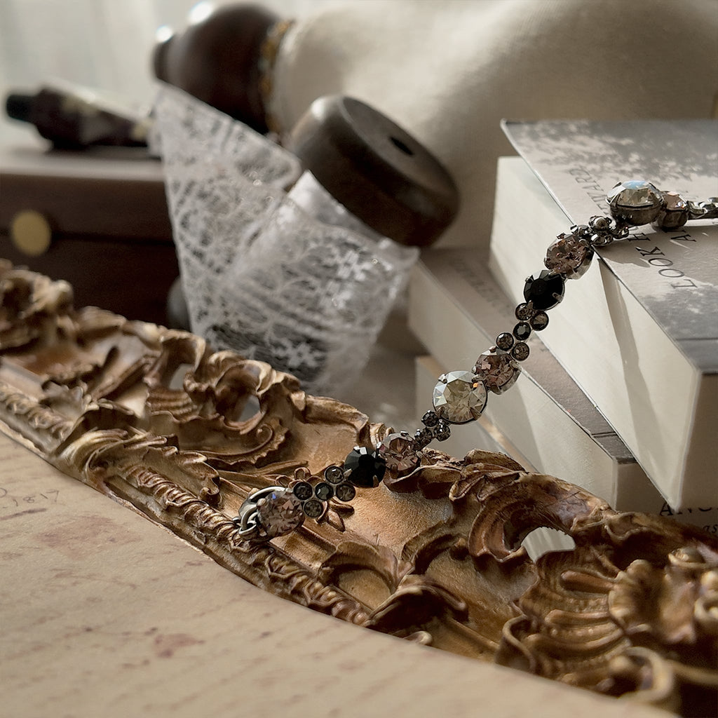 An angled view of the "Rebel Poetess" Gothic Lolita bracelet, highlighting the intricate, multi-stone links and the quality of Sorrelli's craftsmanship.