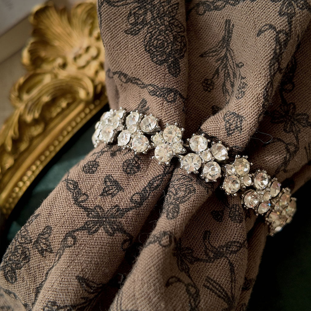 The substantial Trifari crystal bracelet worn on a wrist, showcasing its elegant drape and the incredible, diamond-like sparkle that defines "Quiet Luxury" aesthetic.