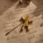 A detailed photo honestly showing the minor, visible plate loss on the sharp edges of the Van Wyk brooch, a sign of its authentic, well-lived history.