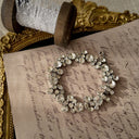 The "Whisper of Sparkle," a dainty vintage tennis bracelet by Weiss, featuring a single, flowing line of brilliant, clear Austrian crystal rhinestones.