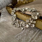 An angled view of the minimalist crystal bracelet, highlighting the fluid movement of the silver-tone links and the exceptional brilliance of the stones.