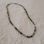 The "Quiet Path" agate necklace styled with a ceramic tea cup to emphasize its "Oriental Zen" and "Forest Core" aesthetic, a true breath of fresh air.